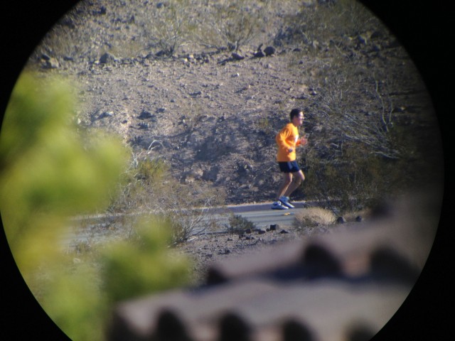  runner on road 1 mile distant on swarovski spotting scope